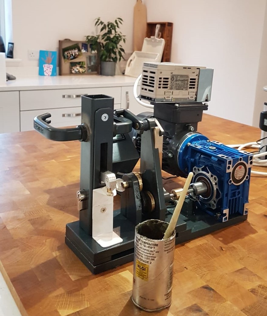 Small testing rig for lock sitting on wooden kitchen table