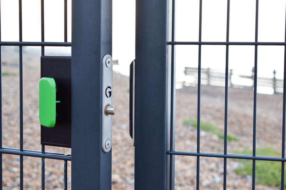 Quick exit panic button gate lock with digital access installed on seaside gate
