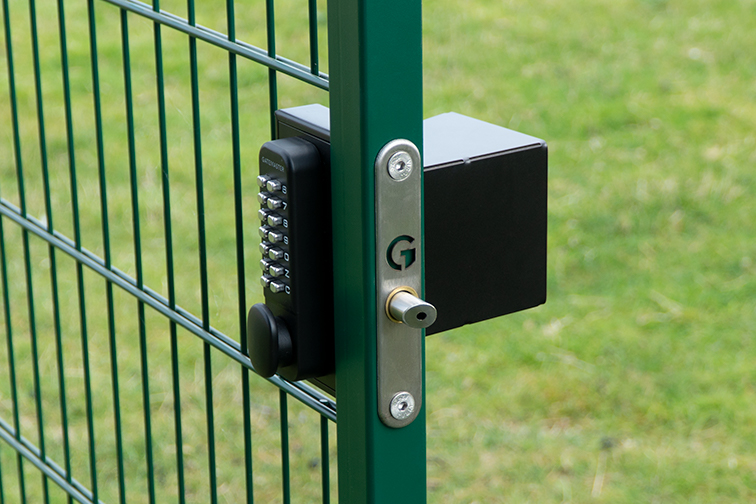 gate locks with code fitted to green metal gate
