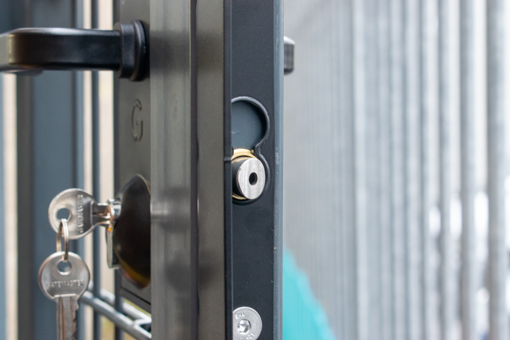 close up image of latch bolt on bolt-on lock for metal gate