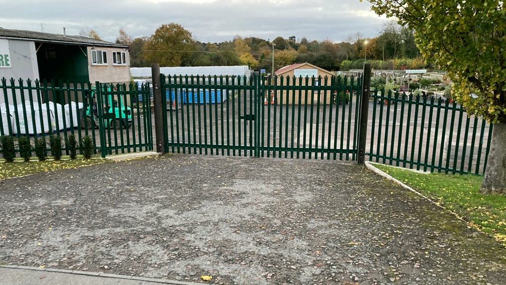 Green palisade fencing on school grounds
