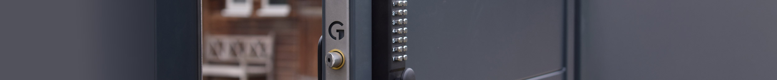 metal gate code lock on gray metal fence